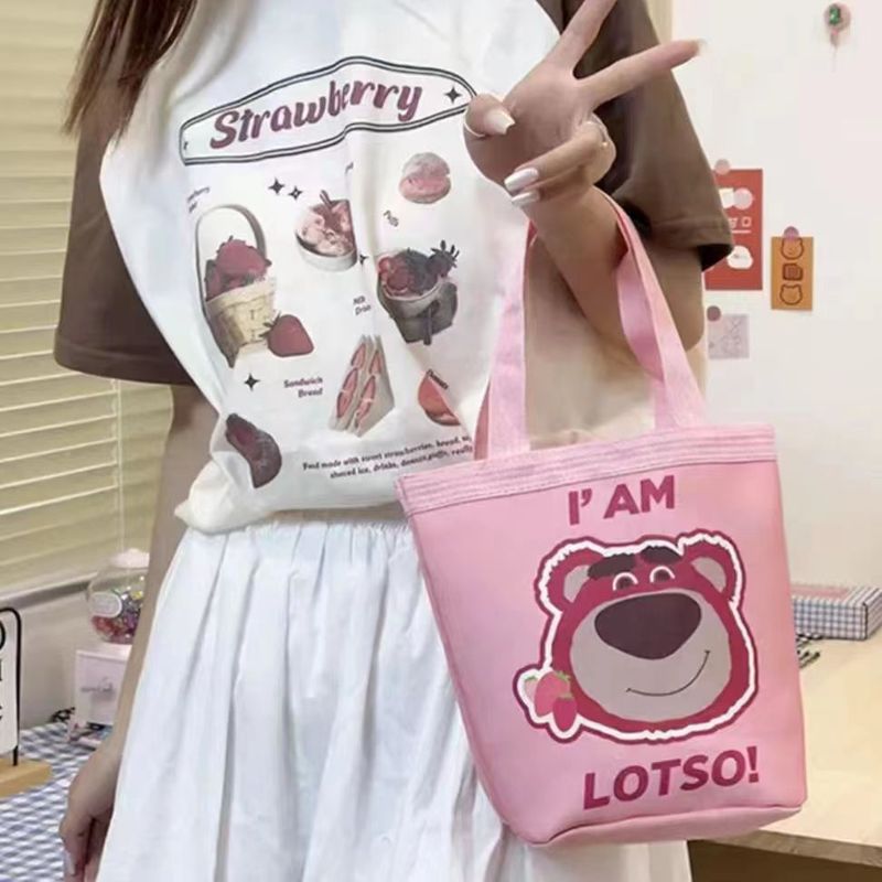 かわいい落書きバケツバッグinsプリント円筒バッグキャンバス弁当袋韓風少女は弁当箱を持っています。|undefined