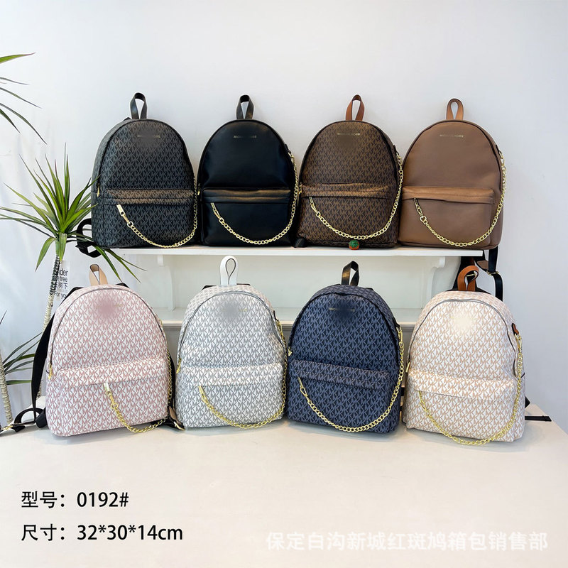 MK's popular printed backpack, a classic and trendy fashion item, perfect for students, featuring an all-over letter print