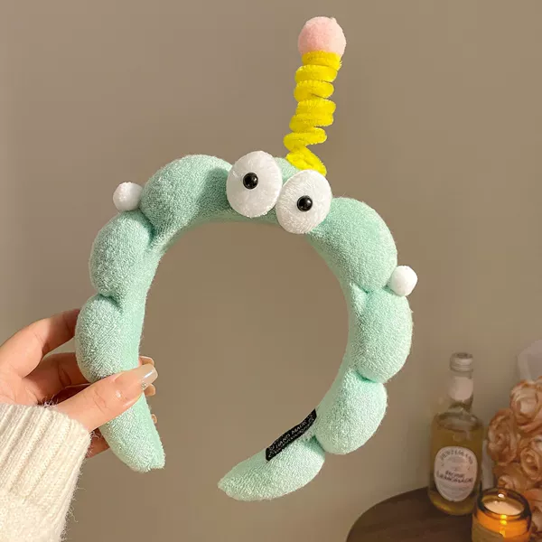Green headband with pigtail