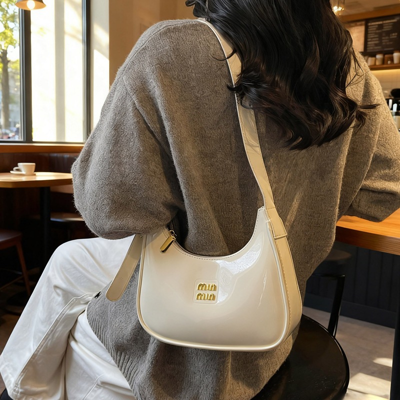 Transfronterizo de alto rendimiento pintado de hombro brazo bolso 2025 nuevo bolso de mano de palo de viaje de hombro bolso de mujer