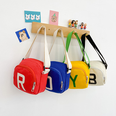 韓版兒童包時尚字母斜挎小背包出遊單肩輕便帆布零食包寶寶配飾包