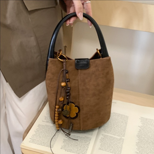 Cross-border 2025 invierno nuevo retro bolso de lona de seda bolso de cubo bolso de hombro de alta calidad para mujeres bolso de transporte