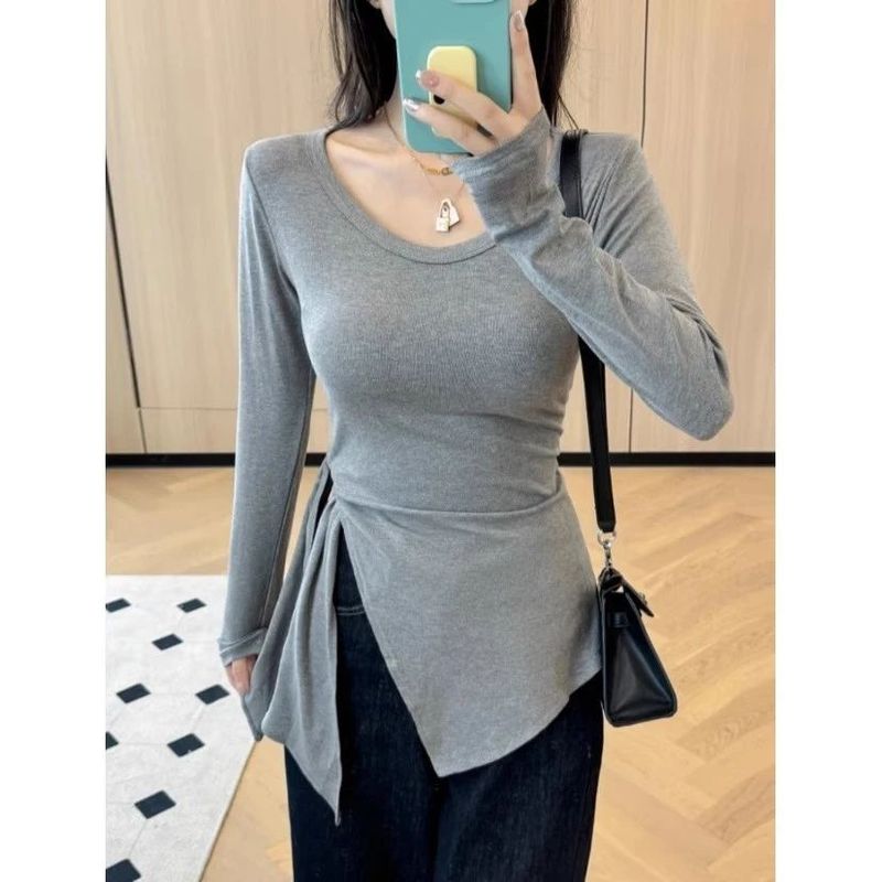 太ったmmの大きいサイズの婦人服の中で長いタイプの修身はやせている長袖のtシャツの不規則な開叉のひもの底のシャツの上着を現します。|undefined