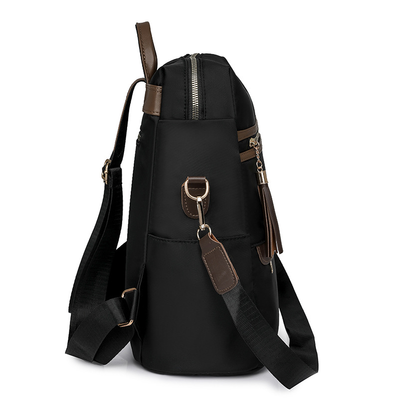 2024 verano nuevo estilo señoras mochila de nailon moda borla gran capacidad contraste color viaje mochila de un solo hombro al por mayor