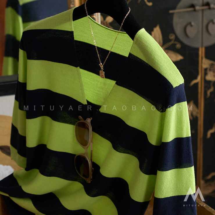 You just need the shopkeeper to keep a slim simple small deep V-neck contrast color wide strip loose knit blouse