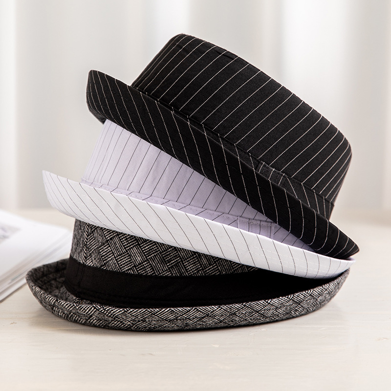 Sombrero de los hombres de primavera y verano británico europeo y americano de moda sombrero de copa a cuadros en blanco y negro a prueba de sol transpirable Jazz sombrero fábrica al por mayor