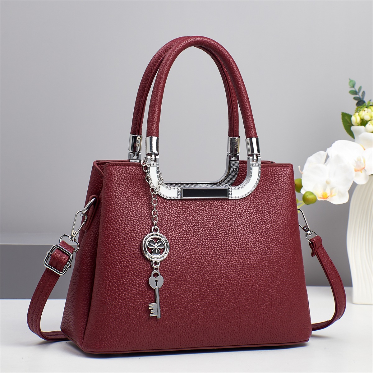 Bolso bandolera de todo fósforo nuevo patrón de lichi de gran capacidad sensación de alta calidad 2025 marca bolso atmosférico mujer de mediana edad