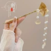 23# folding fan tassel hairpin is about 16.2cm long