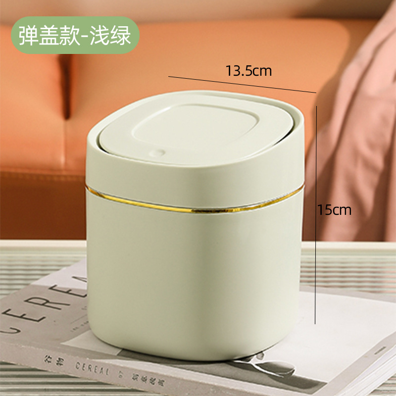 ミニゴミ箱のデスクトップ家庭用かわいいテーブルのお茶のベッドの寝室には、オフィスのテーブルの上の紙くずかごがついています|undefined