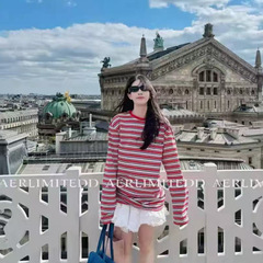 レンガの箱の規格品 ~ I T ᵏ メンズの新型のストライプの長袖のtシャツの女性の潮のブランドのアメリカのカップルはゆったりしていてやせている上着が見えます。