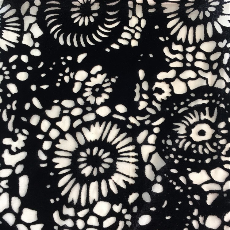 厂家供应锦绒黑色镂空花朵烂花布针梭织女装面料