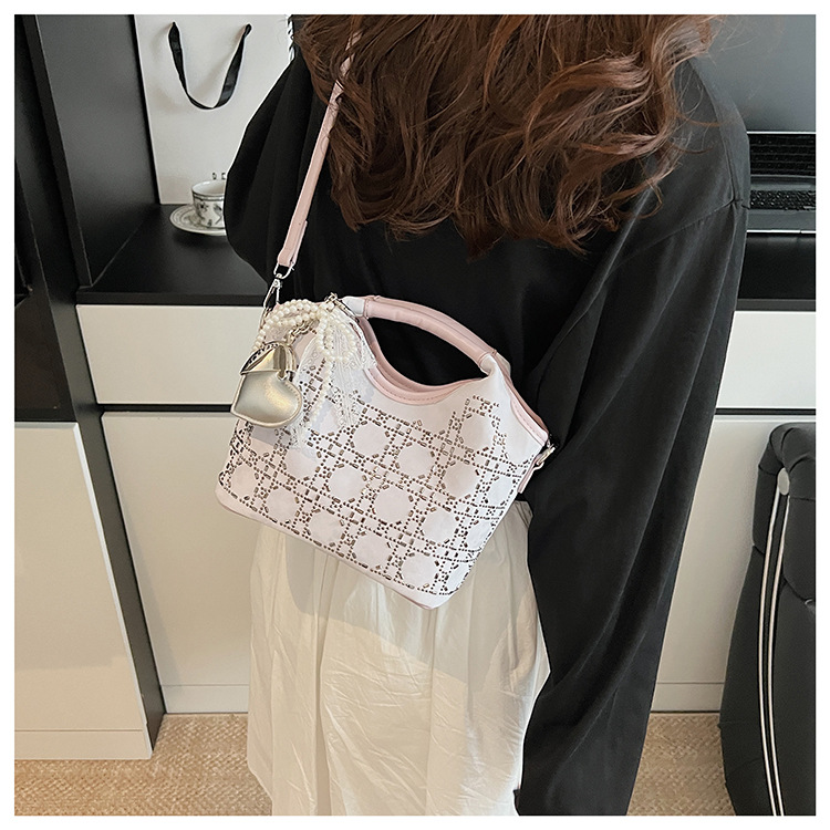 Summer fashion women's versatile hand-held niche crossbody design 2025 simple crossbody bucket bag, new Korean style for commuting undefined