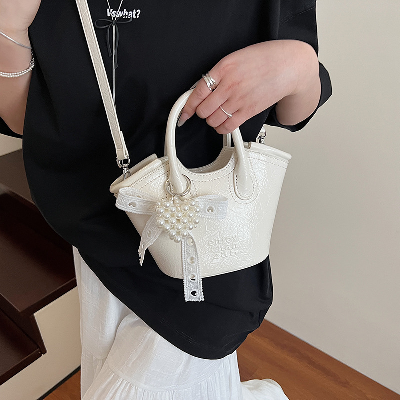 Bolso de cubo de mano de nicho de comercio exterior 2025 nuevo producto bolso de mensajero de moda casual de todo fósforo bolso de hombro de viaje de trabajo de moda