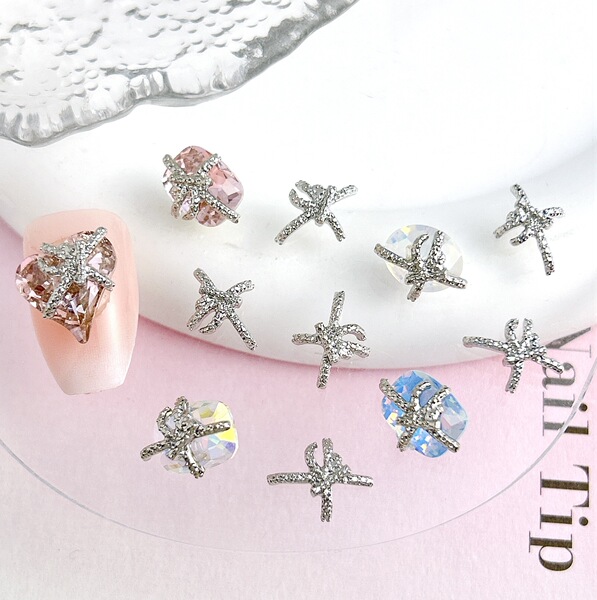 Metal nail decoration with bow