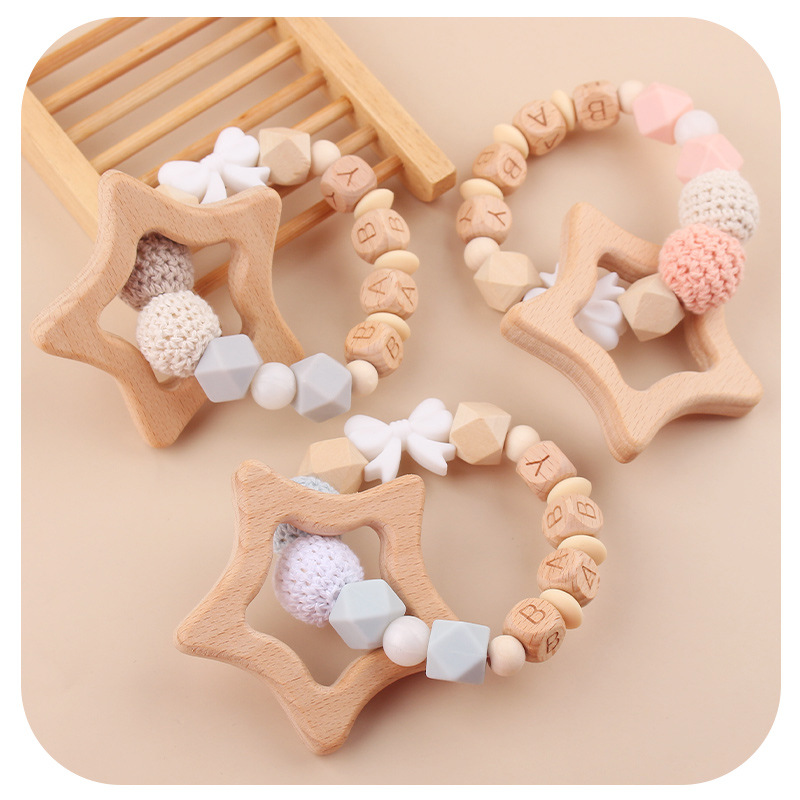 Nuevos productos para bebés abrazaderas de abrazaderas de haz de dibujos animados DIY pulsera de dientes molares decoración colgante de campana cuatro piezas