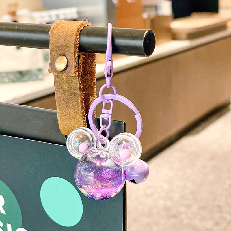 Caricatura en aceite líquido arena flotante botella mochila llavero delicado colgante accesorios accesorios máquina de muñecas pequeños regalos al por mayor