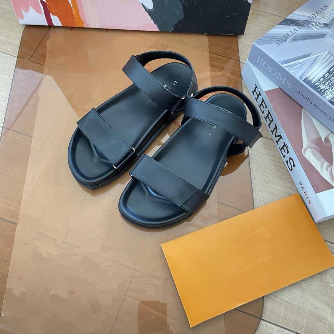 Donkey Home estación europea diseñador de alta versión 2025 nuevas sandalias de playa de cuero zapatillas de hebilla metálica plana