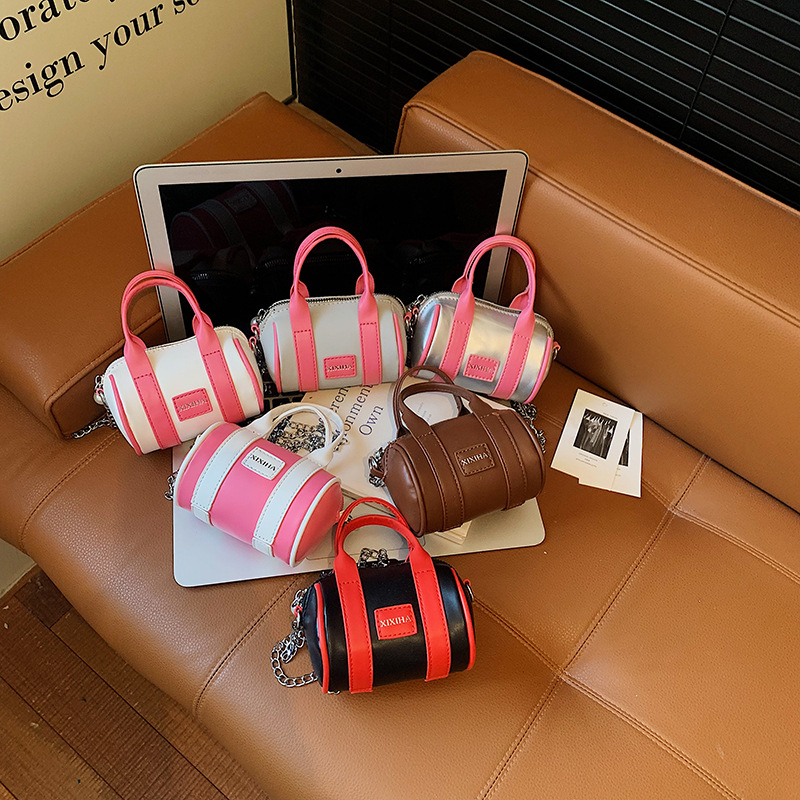Bolsa de almohada cilíndrica de moda de contraste para niños y niñas bolsas de cadena mini lindas para bebés 2026 nuevas bolsas de accesorios para niños