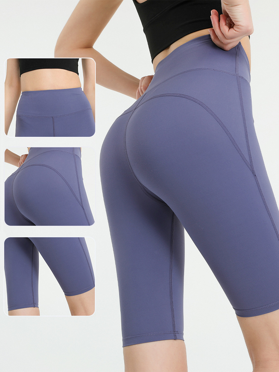 Pantalones de yoga transfronterizos europeos y americanos de cintura alta con efecto levanta glúteos y bolsillos para mujer, shorts deportivos elásticos transpirables de secado rápido y ajuste ceñido.