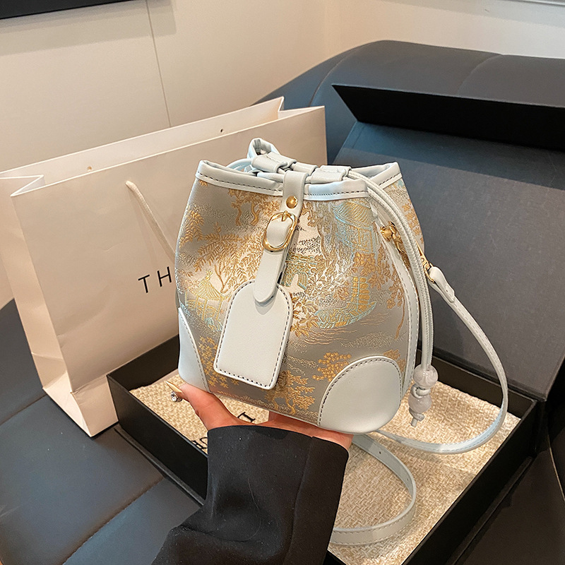 Nationalt nichedesign super populær vestlig bucket-taske, ny kinesisk stil 2024 enkelt skulder crossbody-taske_voghion.com