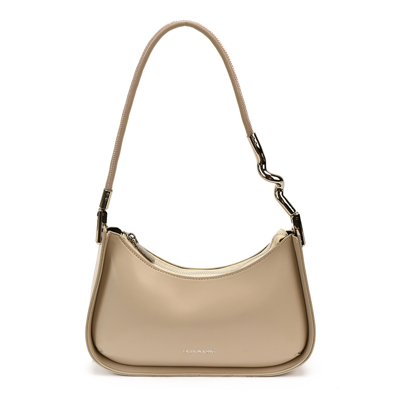 Nicho de diseño bolso de brazo para mujeres 2026 comercio exterior nueva moda alta sensación de viaje simple bolso de media luna de hombro