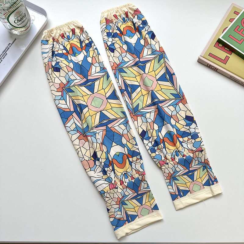 Mangas de protección solar para mujeres de verano nuevo estilo al aire libre anti-UV patrón de montar mangas de brazo de impresión de viento elegante