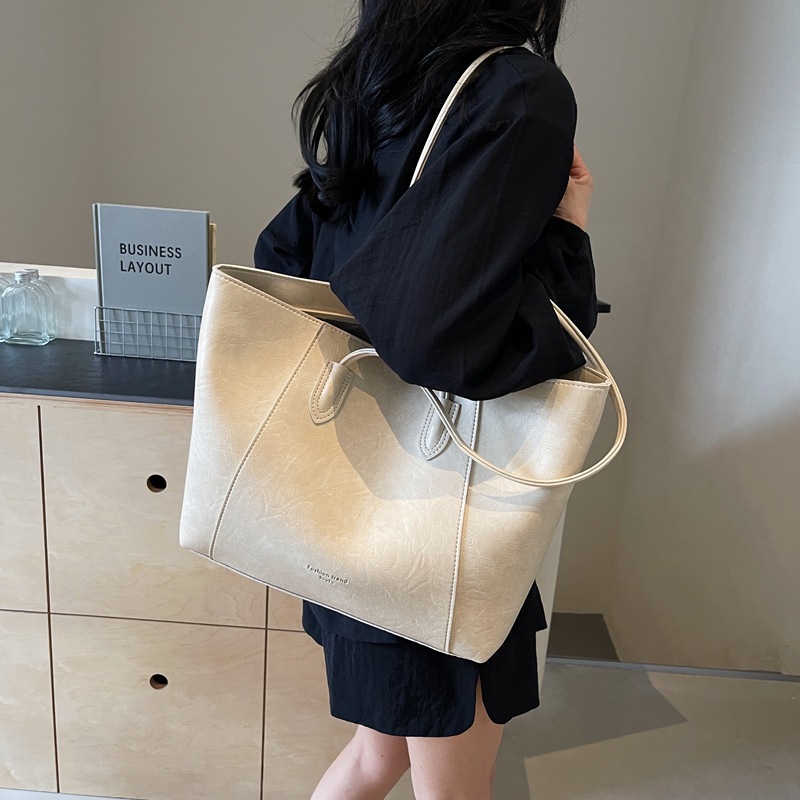 Bolsa de mano transfronteriza de gran capacidad para mujeres 2025 nueva bolsa de brazo portátil de viaje de alta calidad bolso de hombro casual