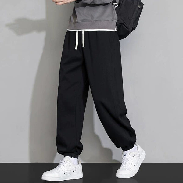 Black solid trousers