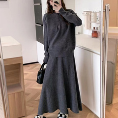 ファッションのカジュアルなニットのセーターのスーツの女性の秋冬の新型のゆったりしている優しい風の上着の半身のスカートはやせている2つのセットを現します。
