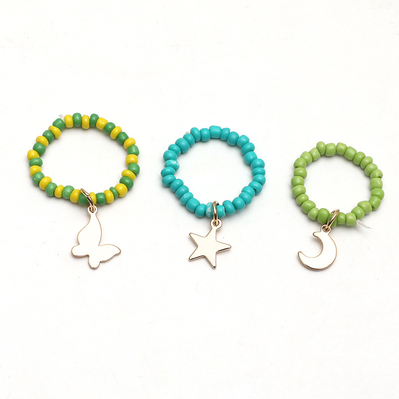 Simple Hand-woven Rice Bead Ring Fashion Temperament Butterfly Moon Star Pendant Elastic 3-piece Set display picture 2