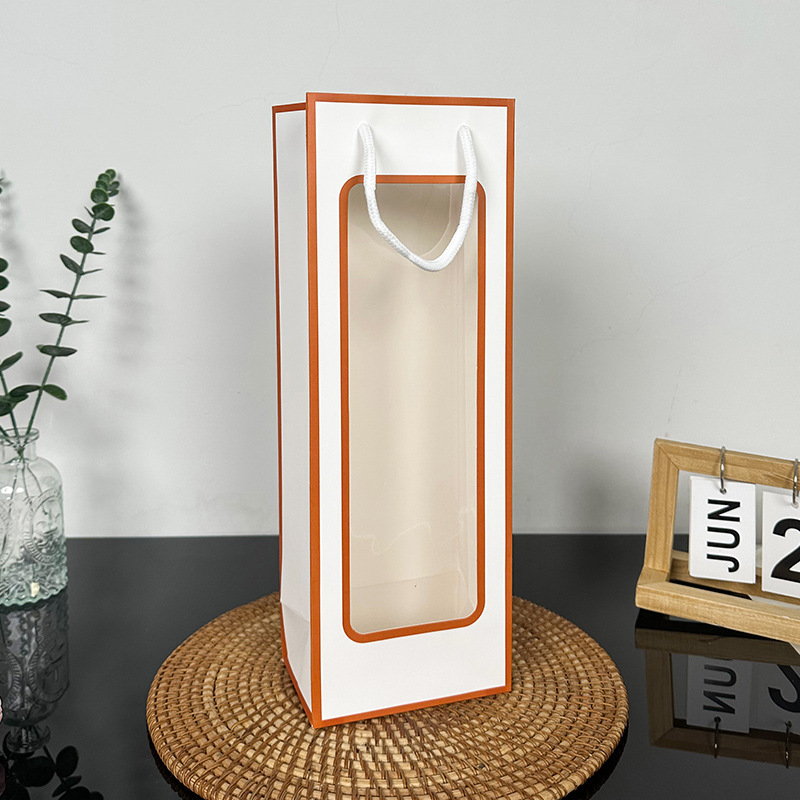 Marco naranja fondo blanco; cartón blanco; bolsa de vino tinto 12,5*8,5*36cm