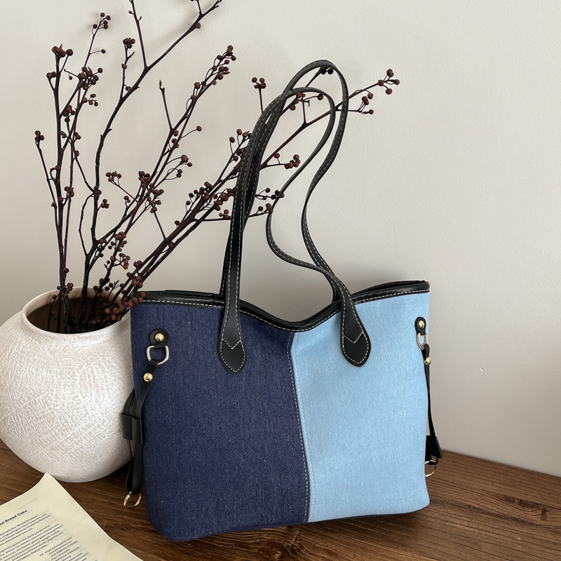 Bolsa de mano de gran capacidad para mujeres 2026 nueva moda jeans empalme color contraste bolso de hombro de viaje simple bolsa de mano
