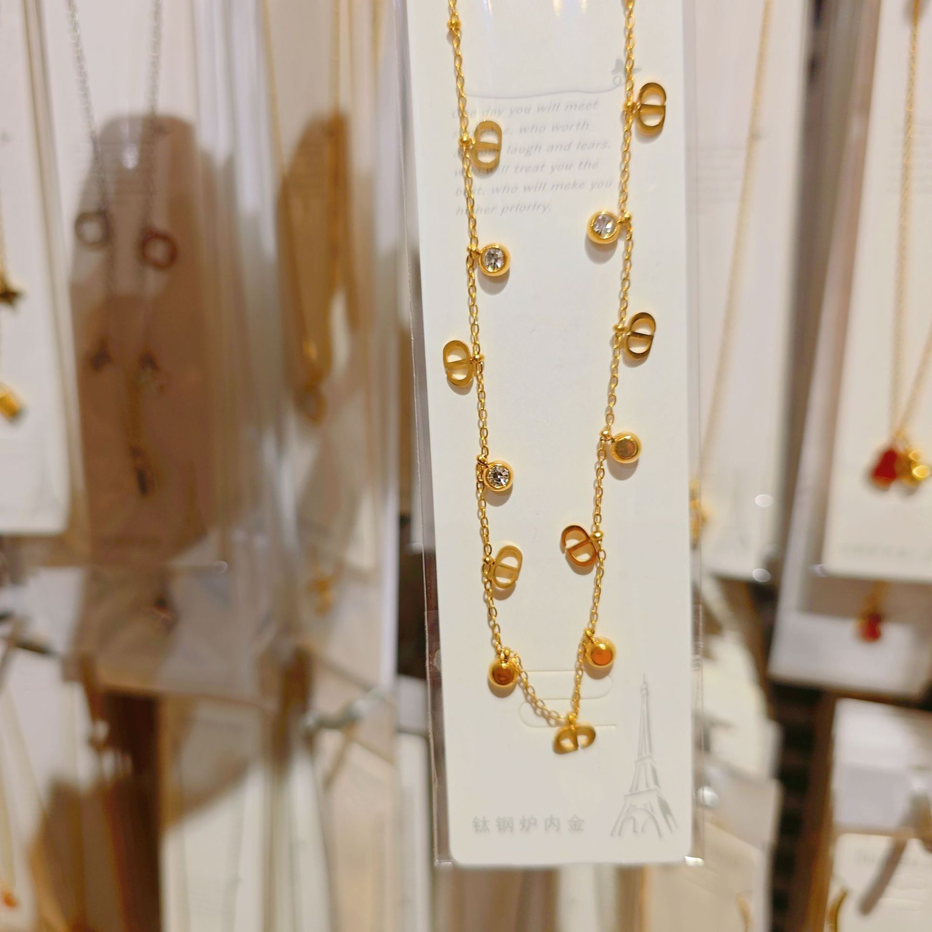 Golden necklace with zircon