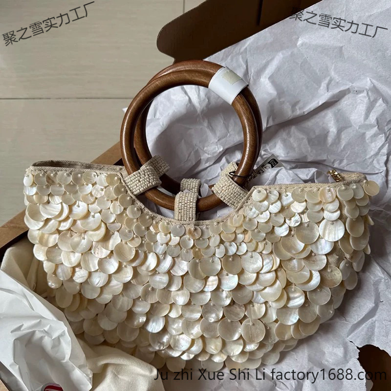 2025 primavera y verano nuevo estilo de alta sensación pura mano natural conchas bolsas de hadas bolsas portátiles bolsas de mujer pequeñas tendencia de personalidad crowdsourcing