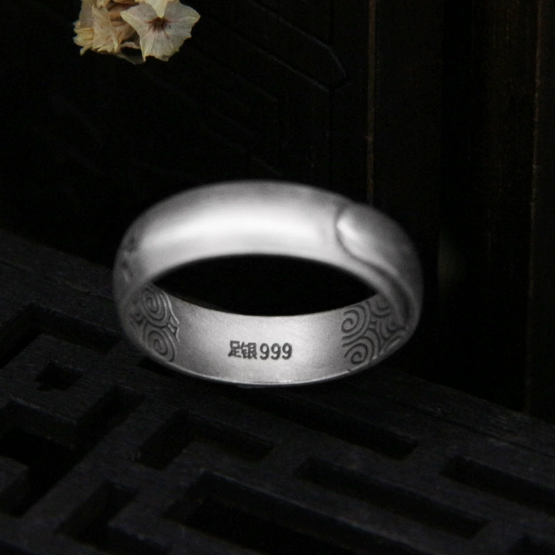 Silver bracelet, retro design ring, on index finger
