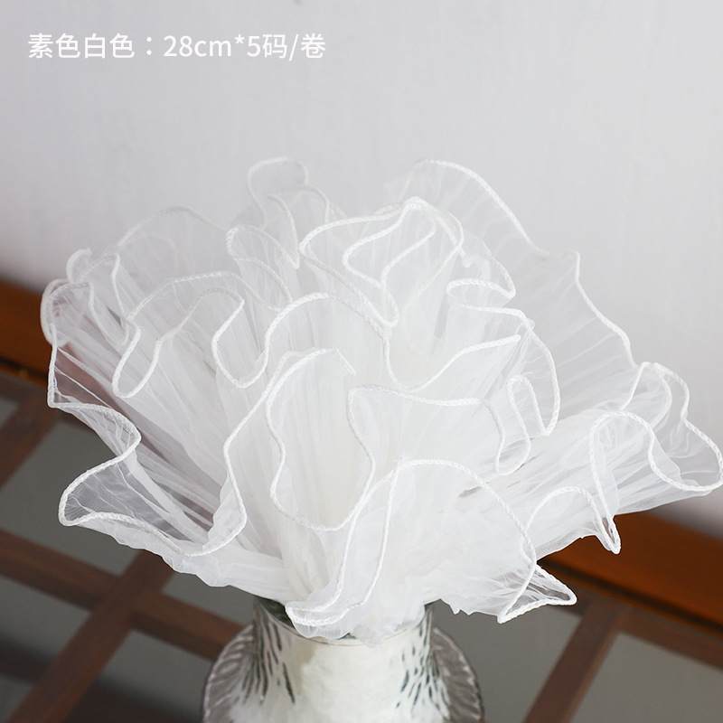 Material de embalaje de flores al por mayor nuevo estilo Chanel de una sola pieza que forma pieza redonda ramo bolsa de tela flor artefacto