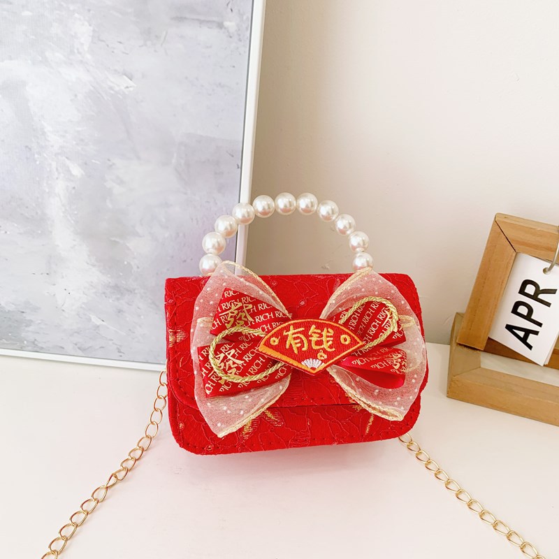 Pequeño viento rojo perfumado bolsos de Año Nuevo para niños y niñas lindos bolsos de perlas de arco 2025 nuevos bolsos de cadenas para niños