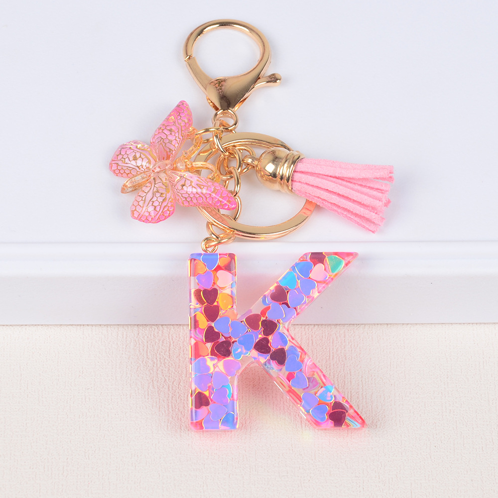 Explosiones transfronterizas amor sequillas iniciales llavero al por mayor resina letra mariposa fringe llavero se puede personalizar