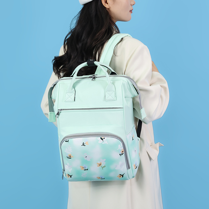 Bolsa de mamá nueva moda impresa mochila de viaje portátil mochila de mano bolsa de biberón independiente bolsa de bebé