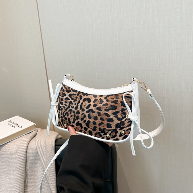 Bolsa de patrón leopardo nuevo estilo retro coreano arco de moda de color contrastante empalme de tendencia personalidad extranjera sensación de hombro bolso axilar