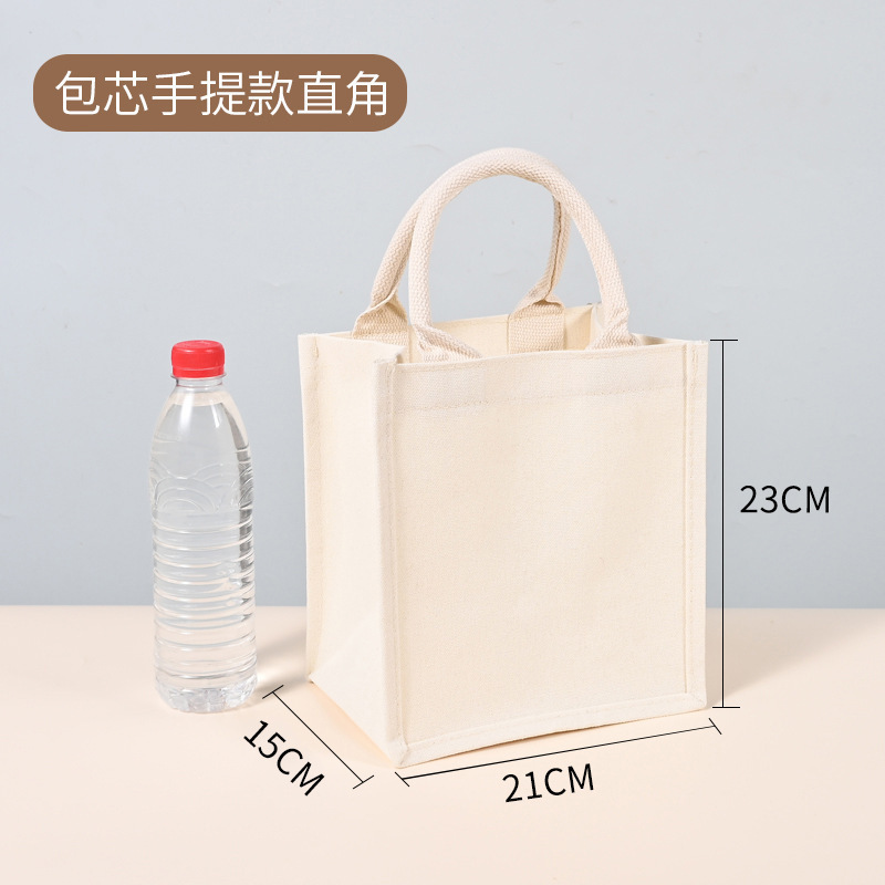 現物の麻の袋と同じ黄麻のショッピングバッグのプレゼントのレトロな亜麻の手提げ袋の空白の手描きの麻の布のカバンは注文します。|undefined
