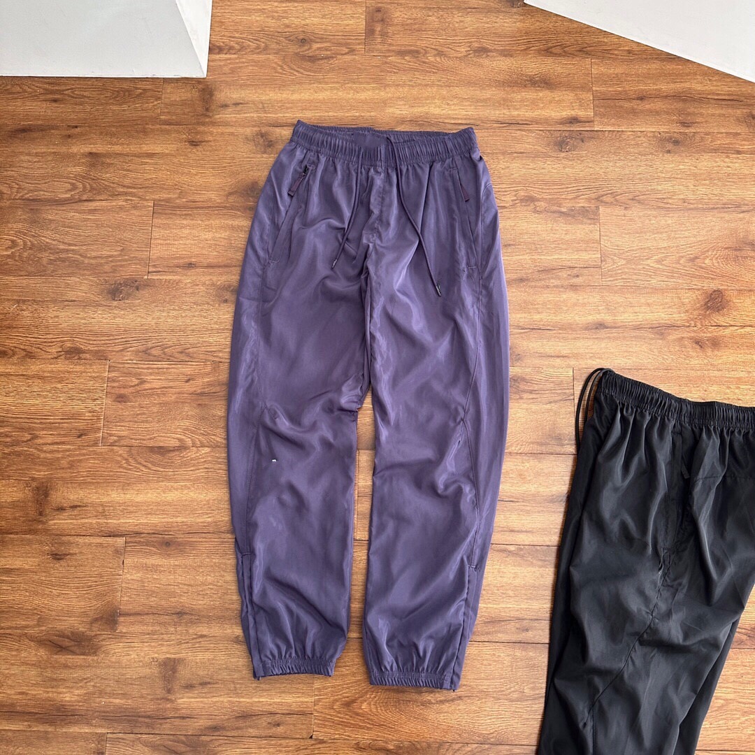 Pantalones deportivos tejidos primavera-verano pareja nuevo nylon rápido secado abrazamiento de pies tejido pantalones deportivos de doble capa para hombre