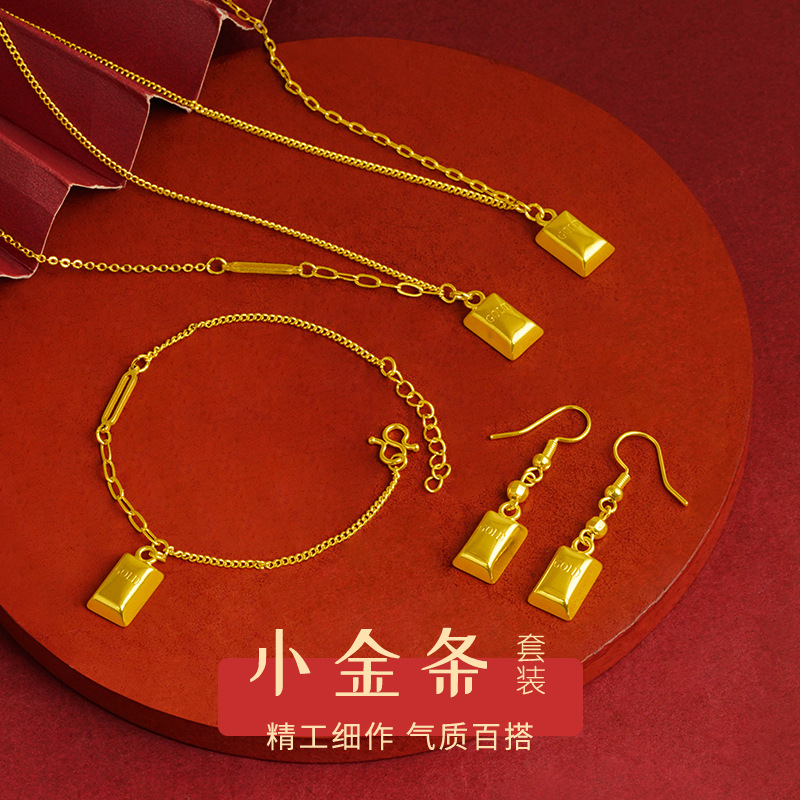 Moda nacional pequeño traje de barra de oro collar de joyería para hombres y mujeres pendientes de todo fósforo pulsera temperamento de moda fábrica al por mayor aleación de cobre