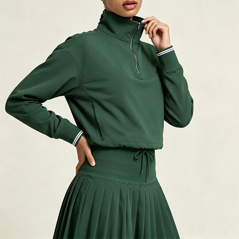 Half-zip, stand-up collar, short-length athletic sweatshirt for women, featuring color-blocked ribbed cuffs, suitable for golf, tennis, and casual wear, and offering wind protection Half-zip, stand-up collar, short-length athletic sweatshirt for women, featuring color-blocked ribbed cuffs, suitable for golf, tennis, and casual wear, and offering wind protection