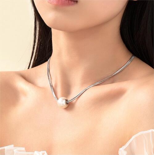 Double-layer stacked pearl titanium steel necklace, fashionable and elegant, versatile clavicle chain for women with elegant niche design.