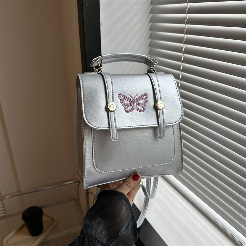 Estilo británico estilo coreano diseño de nicho ins hombro mochila bolso de las mujeres bolsa de cubo estilo universitario 2023 nueva bolsa de mensajero