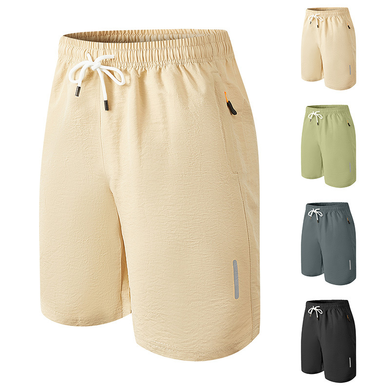 Hombres europeos y americanos Amazon deportes de ocio transfronterizos de secado rápido bolsillo corto tejido con cremallera pantalones tácticos de playa de moda callejera