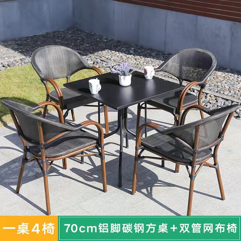 Mesa y silla al aire libre leche tienda de té cafetería silla de malla Silla de ratán Patio de tres piezas balcón mesa y silla de ocio al aire libre