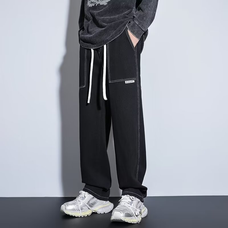 Pantalones casuales de primavera y otoño para hombres, estilo suelto de Hong Kong, sarga, pantalones de trapeador de pierna ancha de arte de moda, jeans deportivos