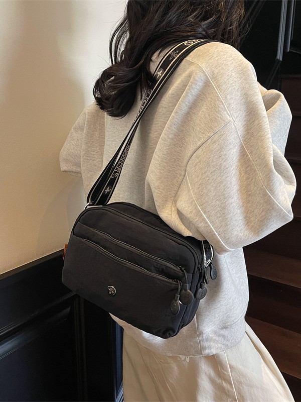 Oxford tela ligera bolsa casuales para mujeres 2025 nuevo estilo simple de moda textura de viaje mochila de hombro
